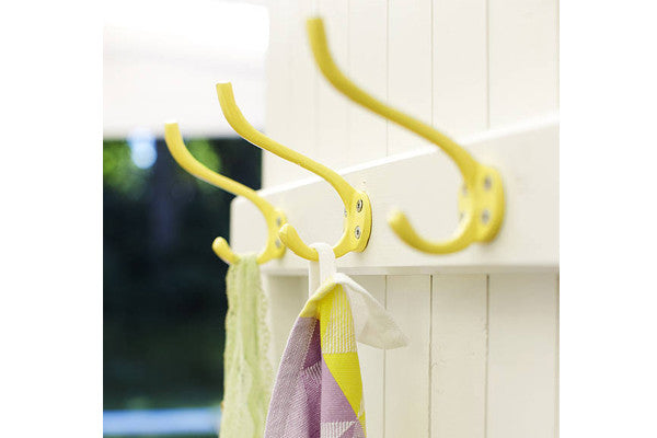retrokitchen yellow wall hooks on timber door